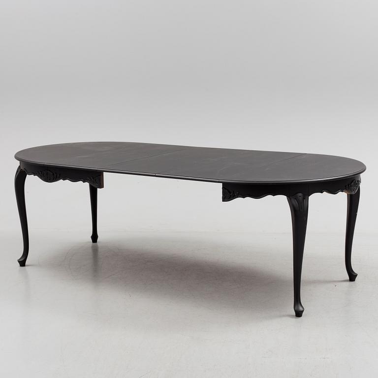 A mid 20th century rococo style dining table.