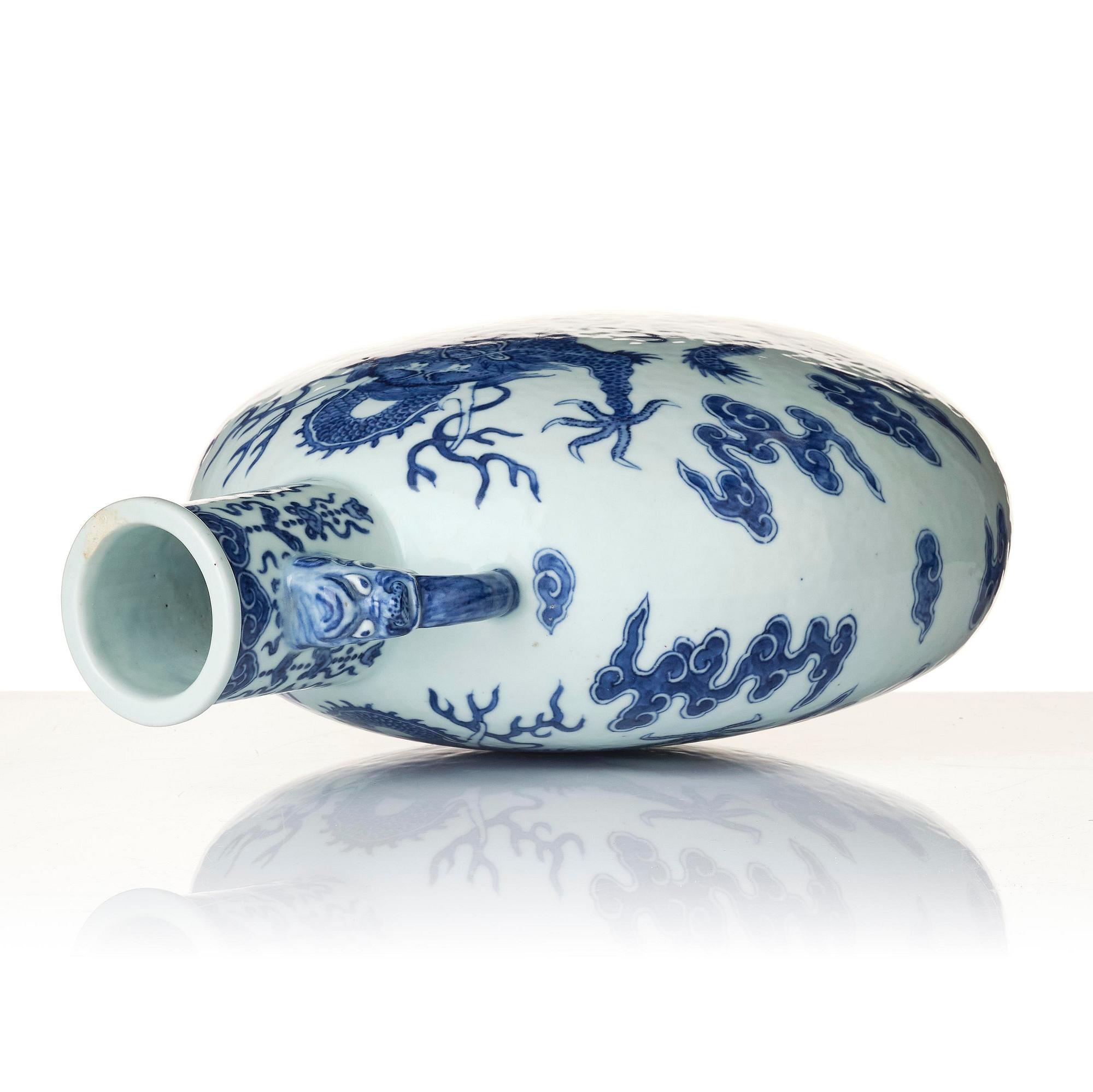 A blue and white 'dragon' moon flask, bianhu, Qing dynasty, 19th century.
