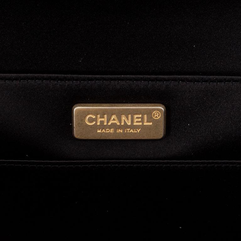 Chanel, a black satin clutch, 2019.