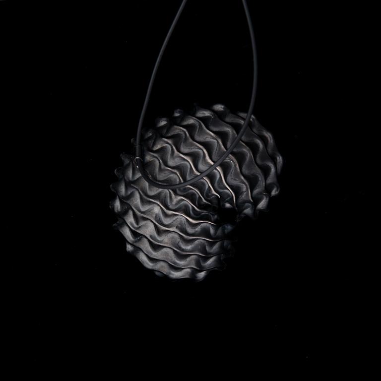 A NECKLACE, "Shelter", oxidated silver, black rubber band, 2010.