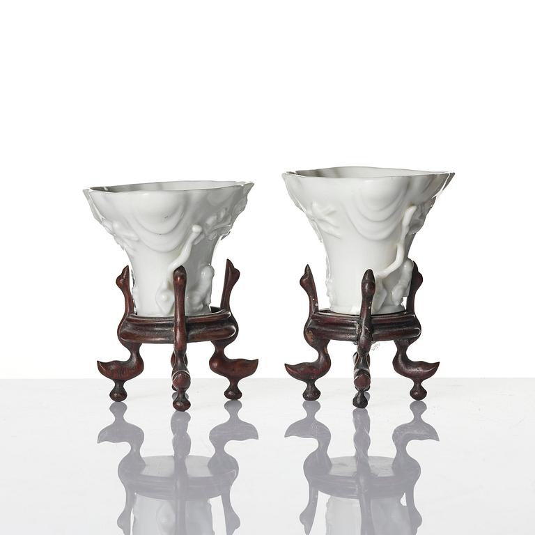 Two blanc de chine rhinoceros libation cups, Qing dynasty, Kangxi (1662-1722).