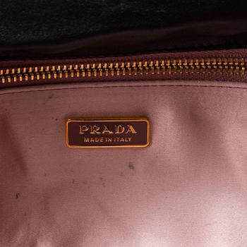 PRADA, a clutch.