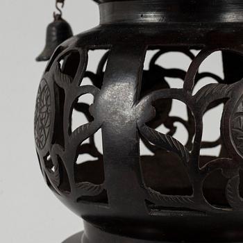 A 20th century Japanese bronze light holder pagoda.