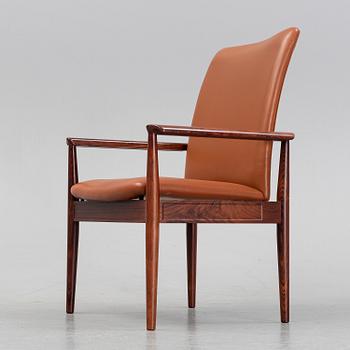 Finn Juhl, a rosewood easy chair, from Cado, Denmark, 1960's/70's.