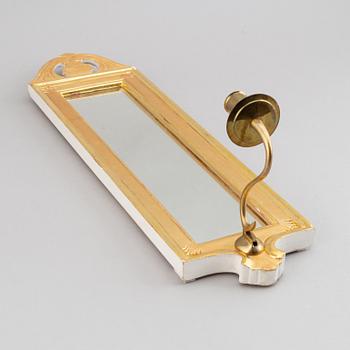 A 'Regnaholm' Gustavian style mirror sconce from Ikea, 1990.