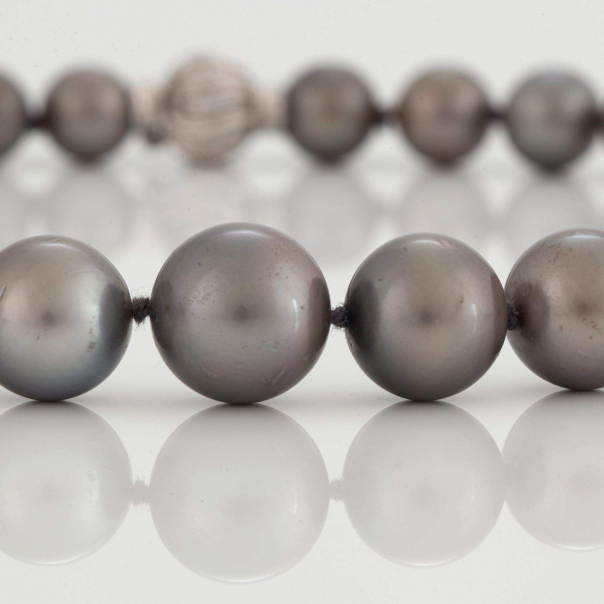 A NECKLACE of cultured Tahiti pearls.