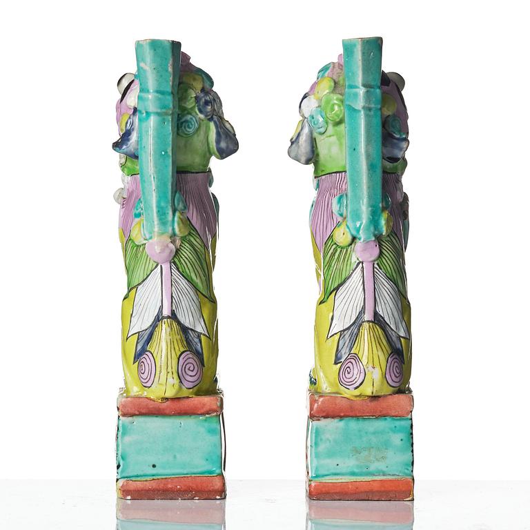 A pair of famille rose 'buddhist lion' joss stick holders, Qing dynasty, circa 1800.