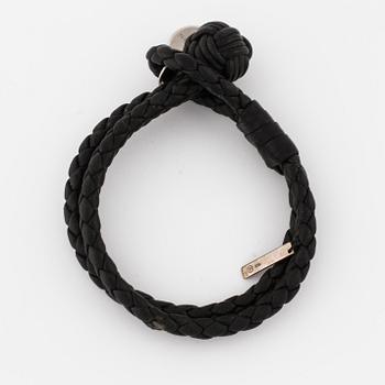 A bracelet by Bottega Veneta.