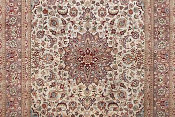 A carpet, Oriental, part silk, c. 283 x 185 cm.