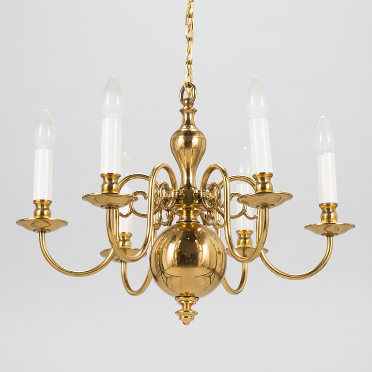 A six-arm brass chandelier, last quarter of the 20th-century.
