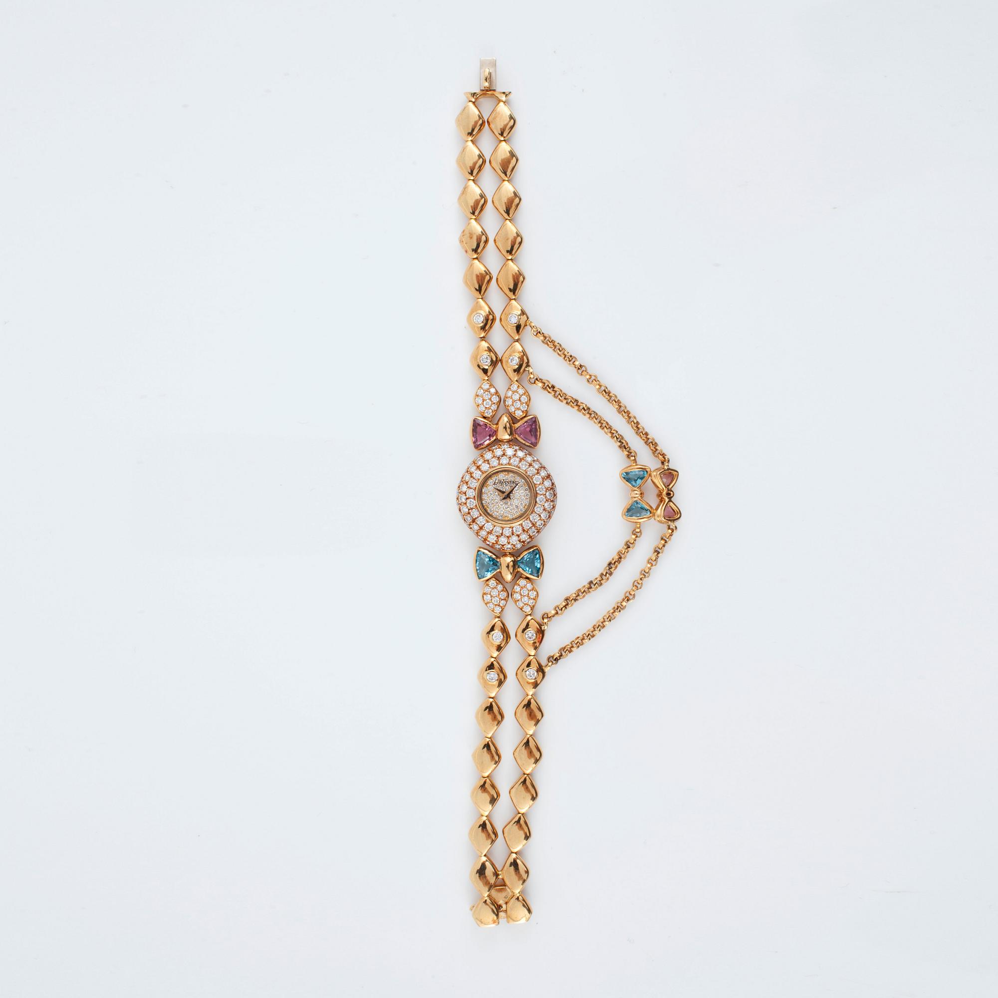 A DeLaneau ladies wristwatch set with brilliant-cut diamonds, pink topaz and aquamarine.