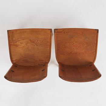 Axel Einar Hjorth, a pair of stained pine 'Lovö' chairs, Nordiska Kompaniet, Sweden 1930s.