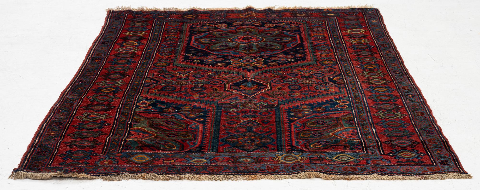 An antique Northwest Persian rug, c. 179 x 143 cm.