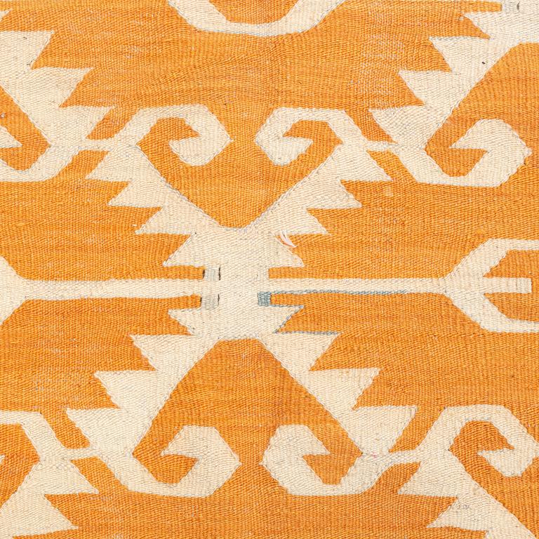 A flat weave rug, c. 285 x 263 cm.