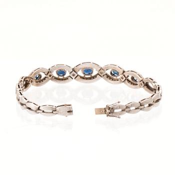 An 18K white gold bracelet set with oval faceted sapphires and brilliant-cut diamonds, Stockholm.