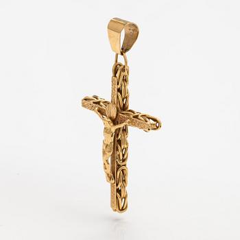 An 18K gold cross pendant.