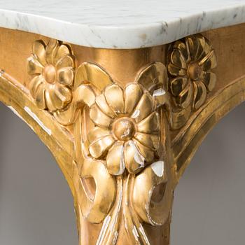 An Art Nouveau mirror with console table from early 20th century.