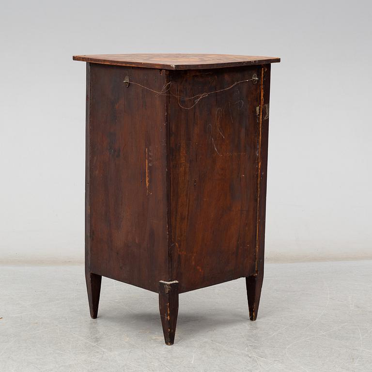 A 19th century corner cabinet.