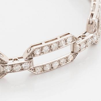 A platinum bracelet set with old-cut diamonds.