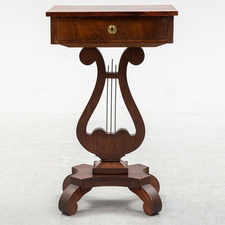 An early 20th century sewing table.