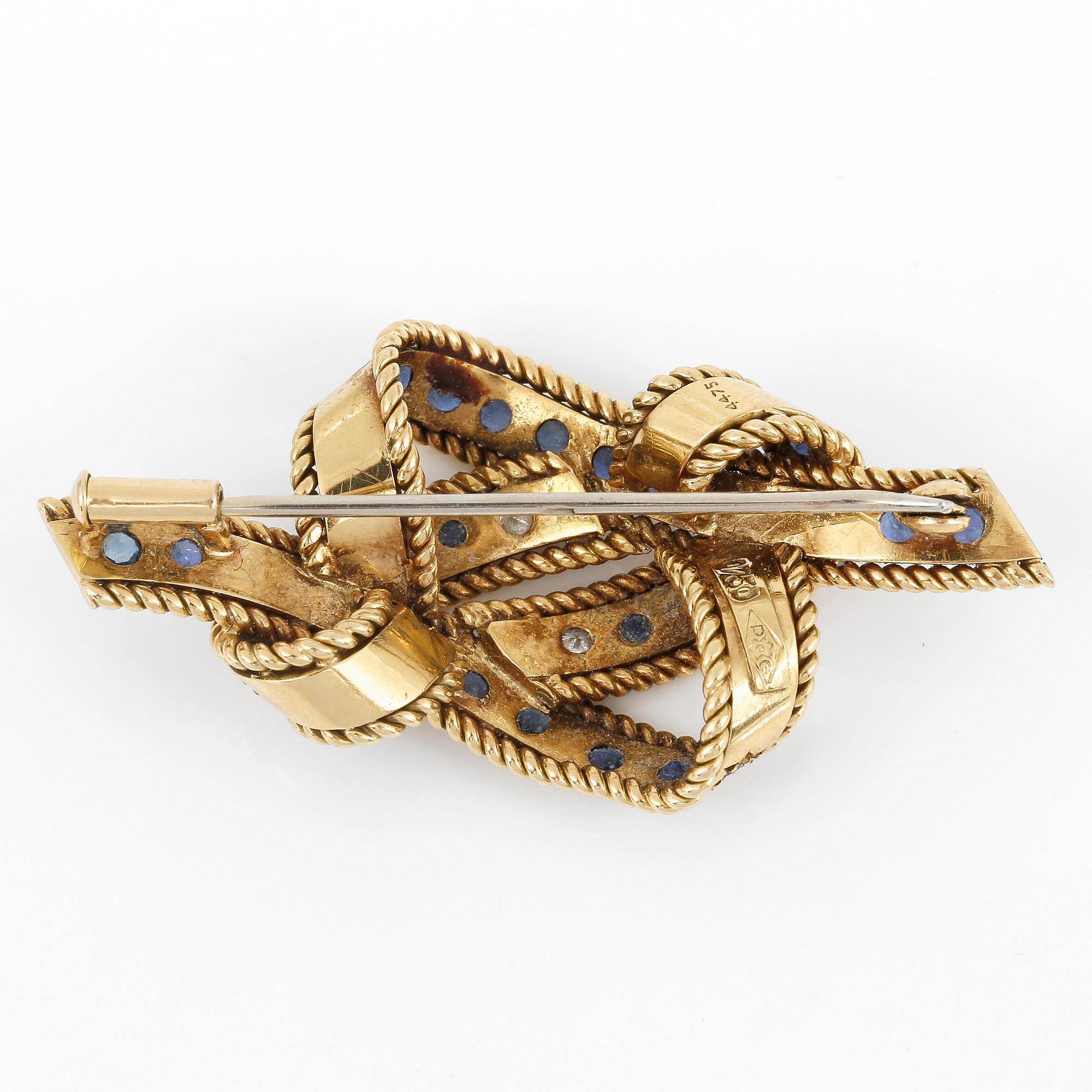 BROSCH, med briljantslipade diamanter, ca 0,24 ct och troligen fasetterade safirer.
