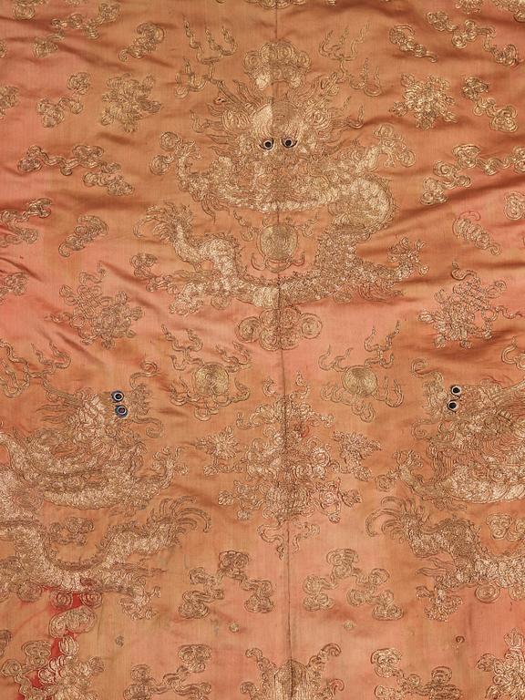 A ROBE, embroidered silk, height 131 cm, China late Qing dynasty (1644-1912).