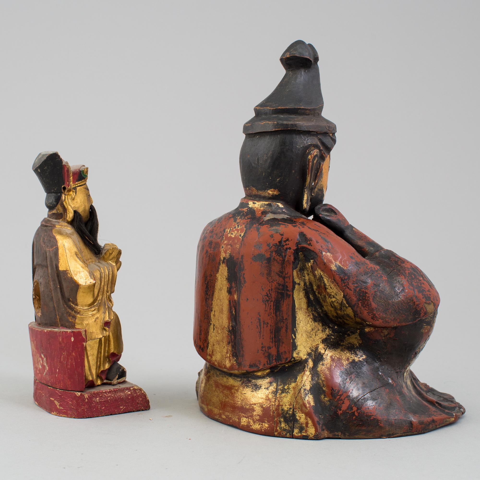 A pair of lacquered wooden deities, late 19th Century.