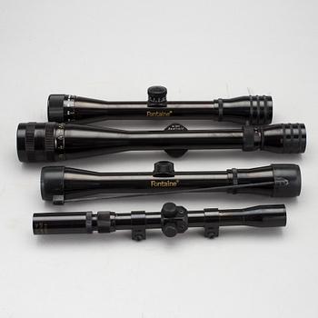 GEVÄRSTILLBEHÖR, bland annat 4 kikarsikten. 1900-tal.