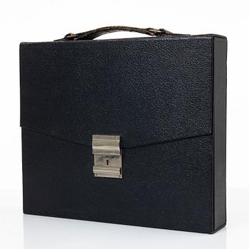 80 perfume bottles in a consultant's portfolio, S.A. Tombarel Freres, Grasse, France, 1950's.