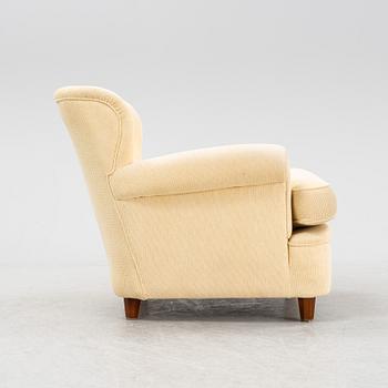 Josef Frank, a model 568 armchair by  Firma Svenskt Tenn.