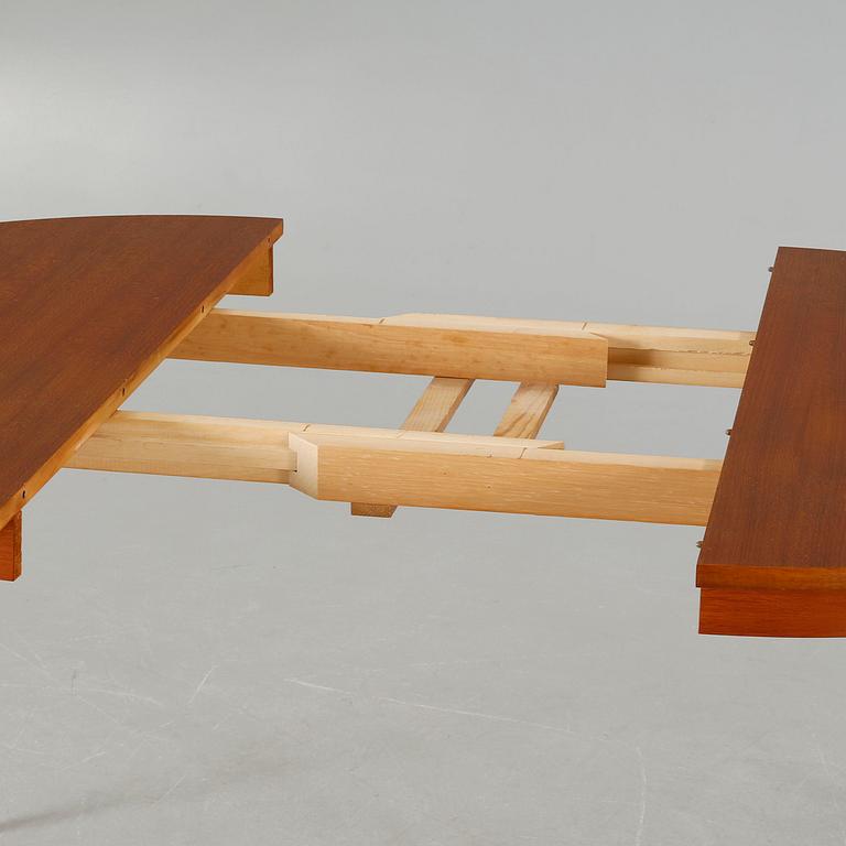 A dining table made in the middle of the 20th century.