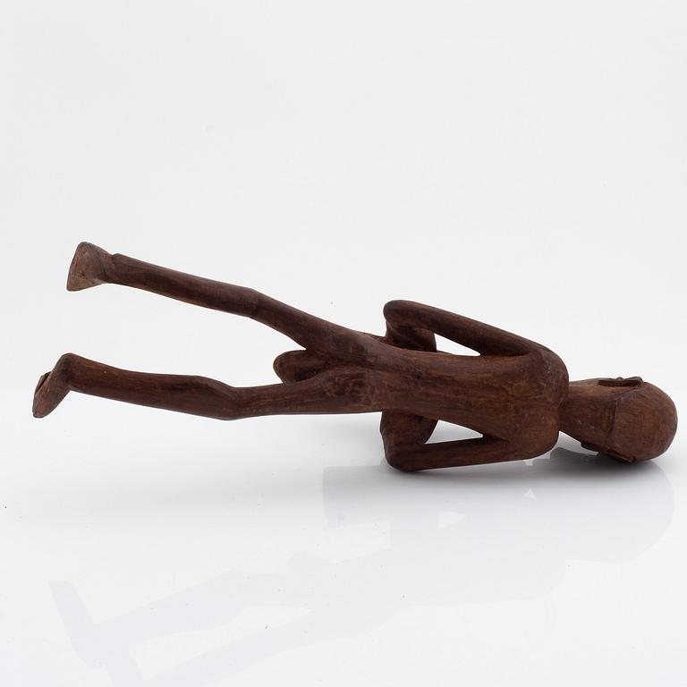 A group of three wooden Asmat sculptures, 20th Century.