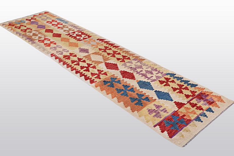 A runner, kilim, ca 298 x 74 cm.