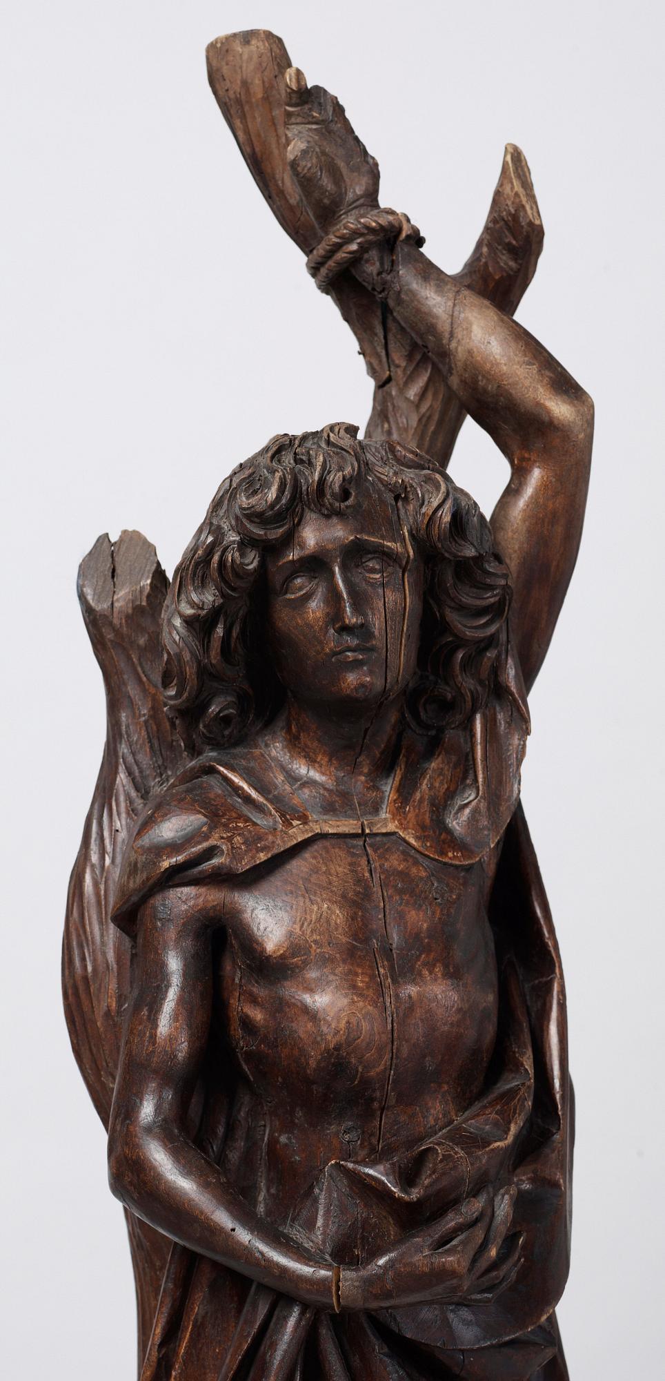 A wooden sculpture depicting St Sebastian, probably German, circa 1500.