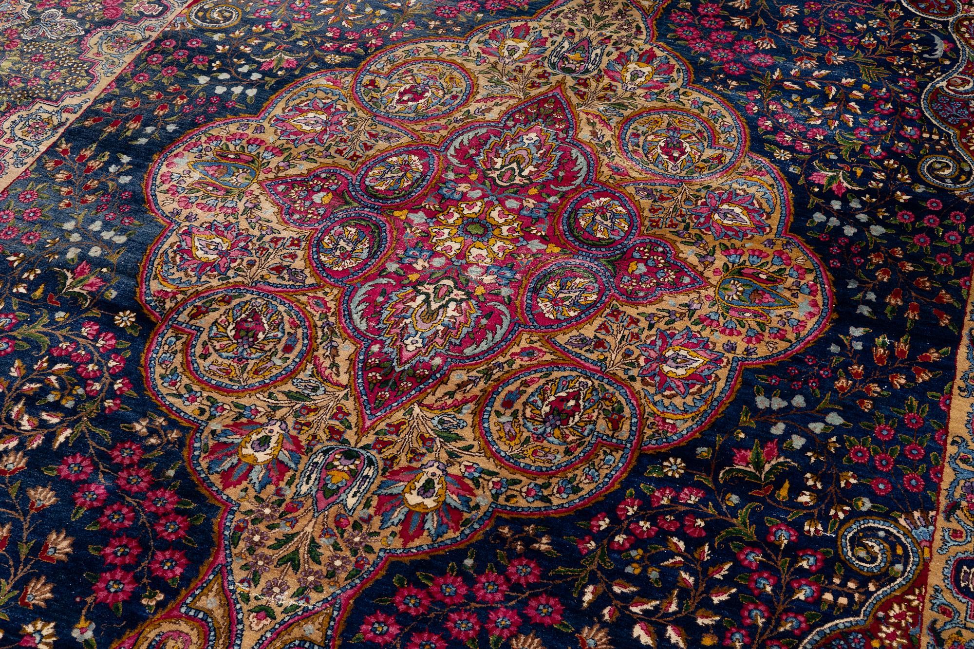 A semi-antique Kirman carpet, south Persia, c. 440 x 279 cm.