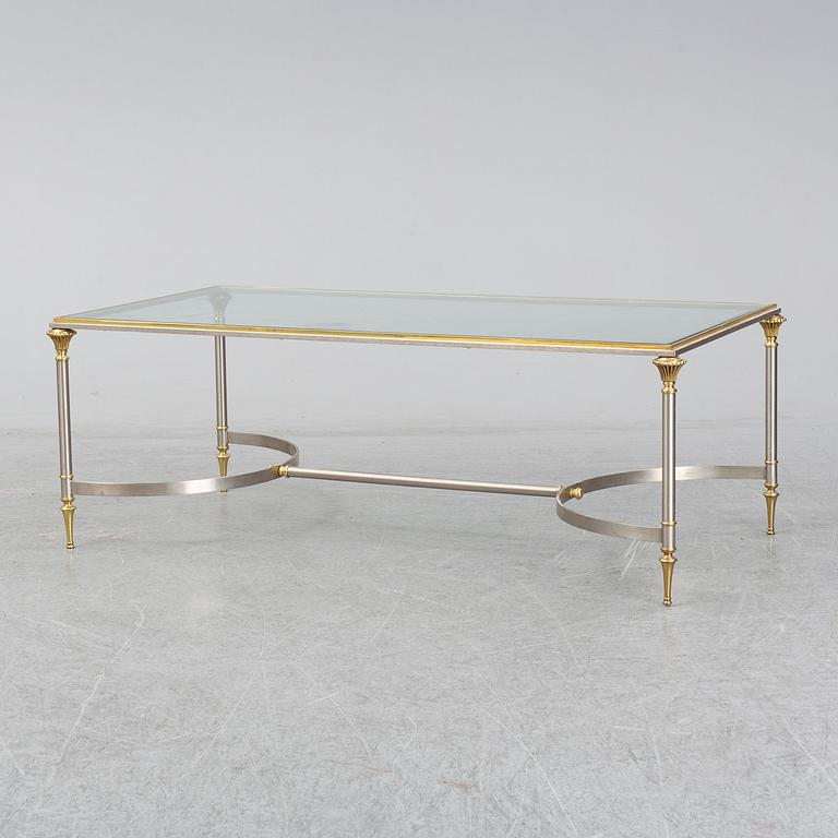 A 1970s sofa table, brass and glass.