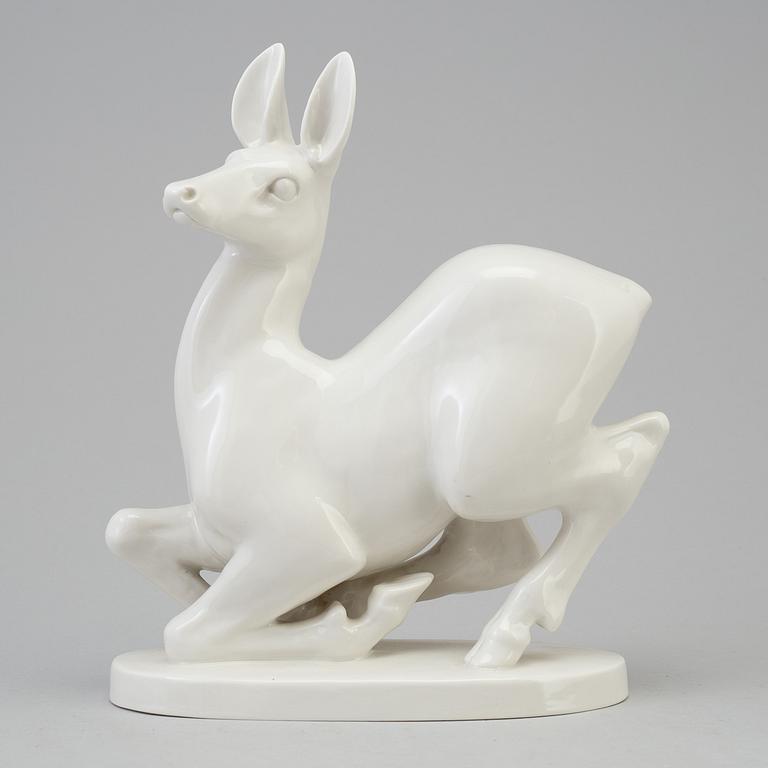 A Russian white glazed figurine of a deer, Lomonosov, St Petersburg, 1960/70's.