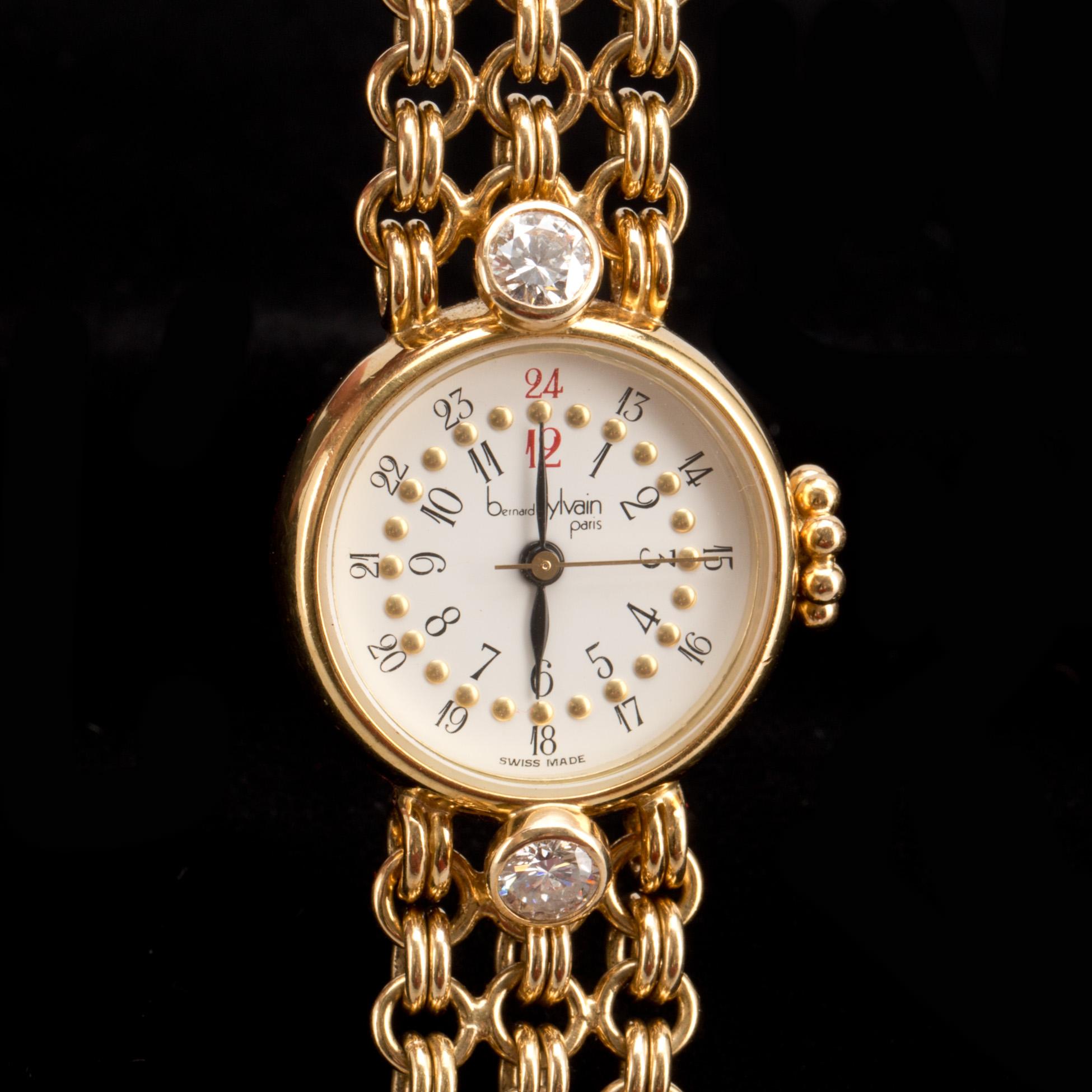 ARMBANDSUR, 18K guld med briljantslipade diamanter ca 0,60ct, Bernard Sylvain, Paris. Vikt ca 56g.