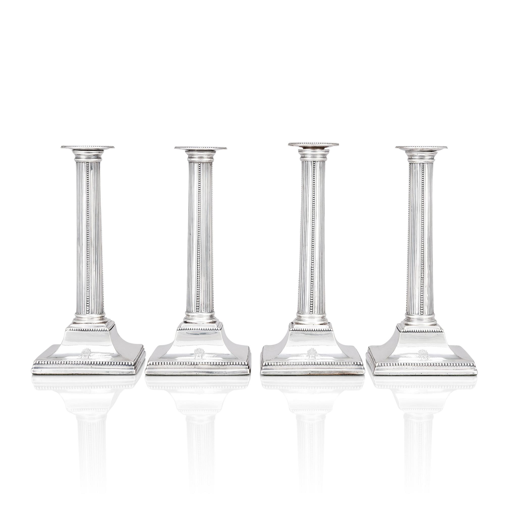 Four English 18th century silver candlesticks, mark of Young, Greaves & Hoyland, Sheffield 1780.