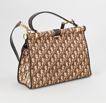 A brown monogram canvas handbag by Christian Dior.