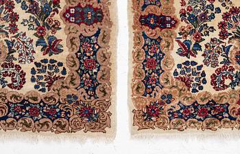 A pair of similar Kirman rugs, south Persia, c. 147 x 94 and 154 x 96 cm.