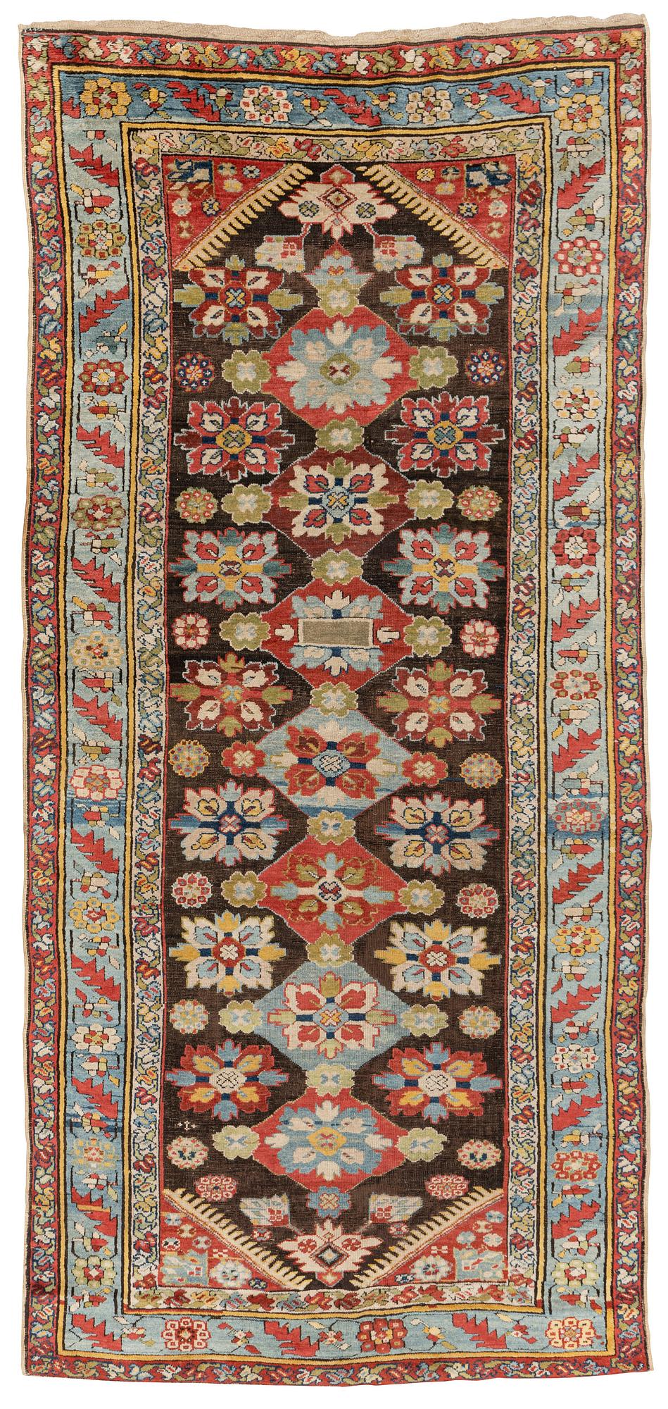 An antique Karabagh carpet,  ca 330 x 157 cm (one end with 1-3 cm flat weave).