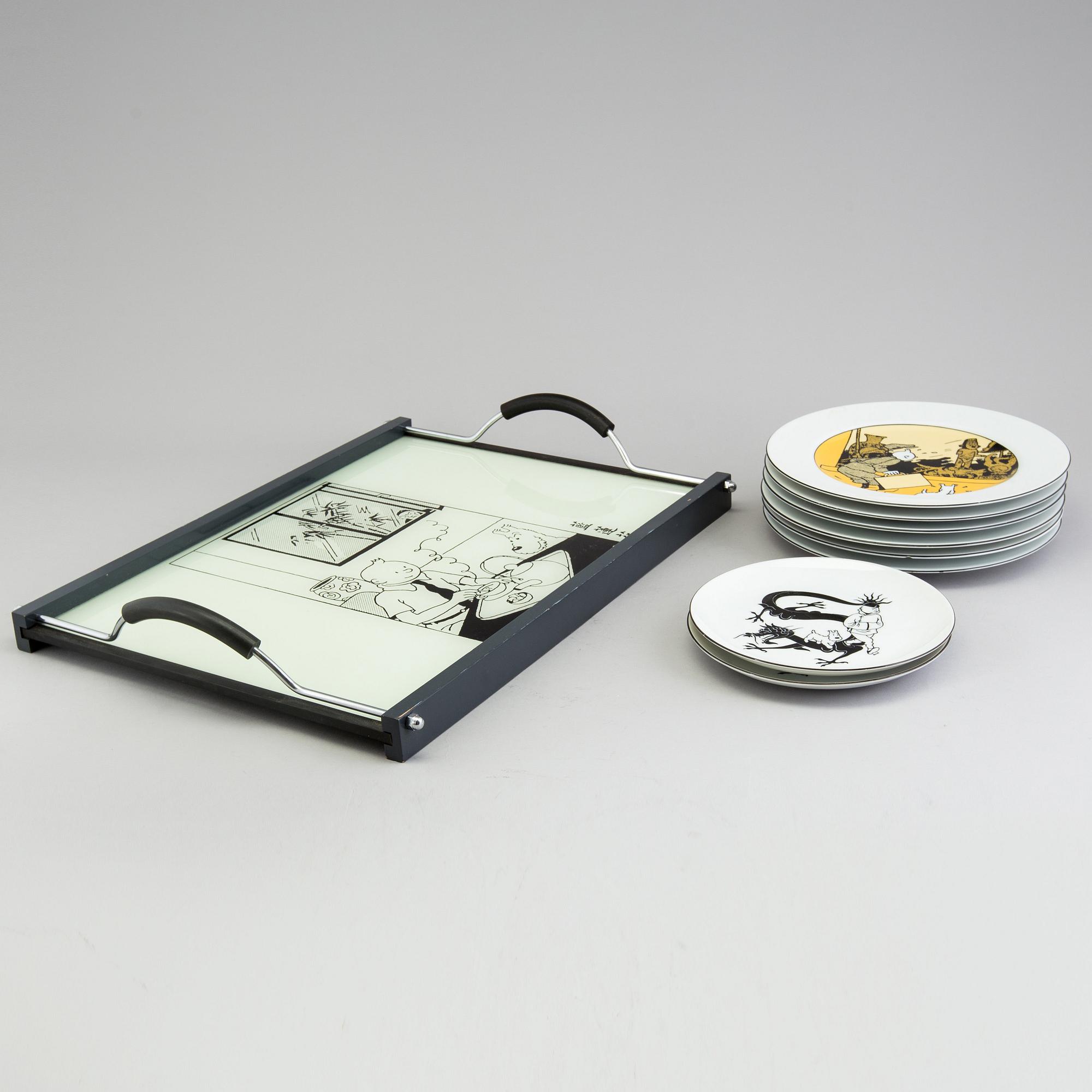 A set of 6 dinnerplates and two small plates and a serving tray depicting Tintin, Axis, France.