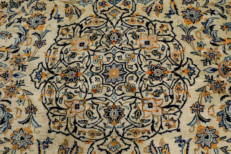 A Keshan rug, signed, ca 370 x 268 cm.