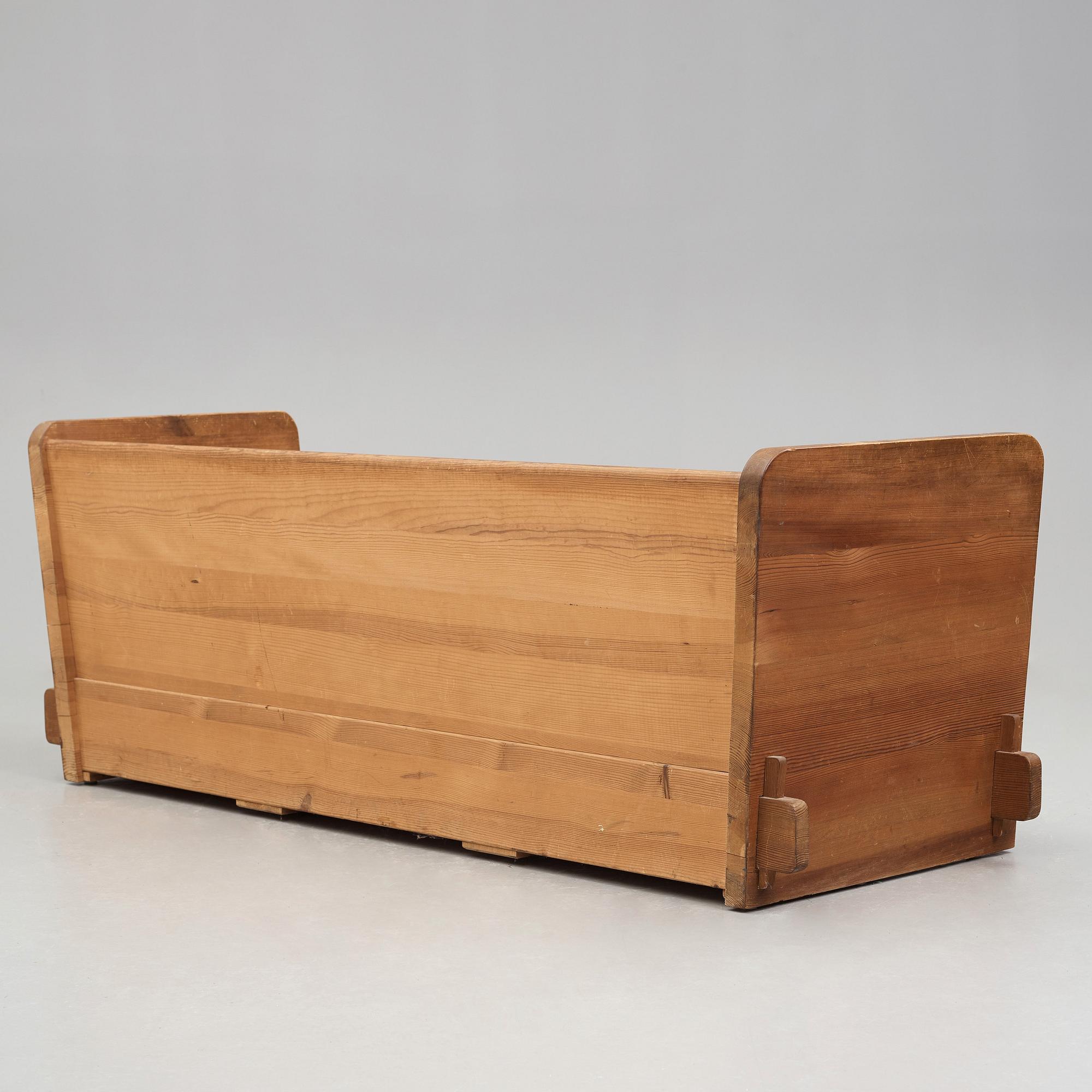 Axel Einar Hjorth, a stained pine "Lovö" sofa, Nordiska Kompaniet, Sweden 1930's.