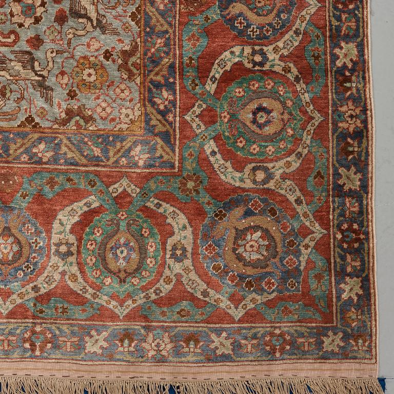 A RUG. A semi-antique silk figural souf (in relief), probably India. 208 x 128,5 cm (as well as two cm flat weave at.