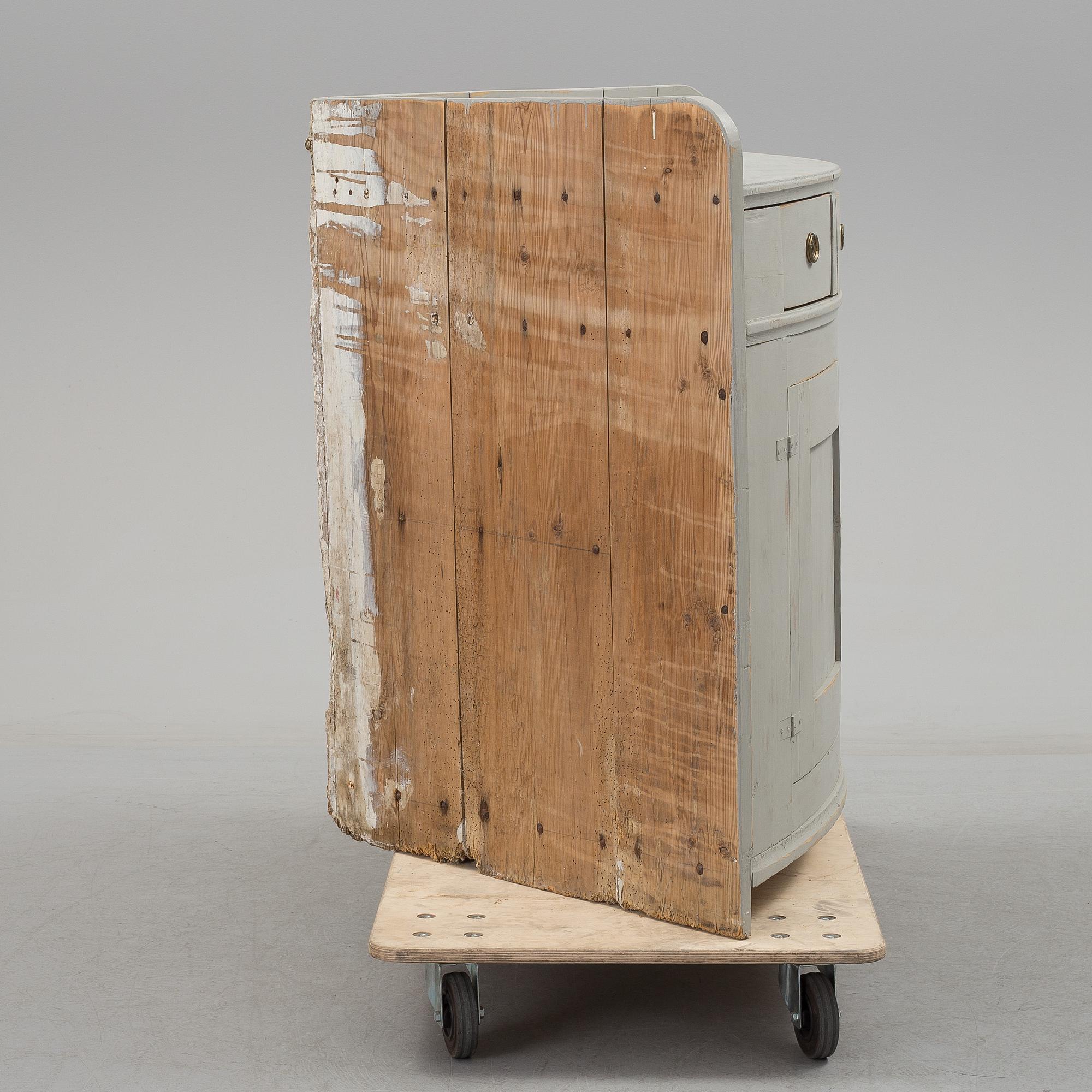 A mid 19th century corner sideboard.