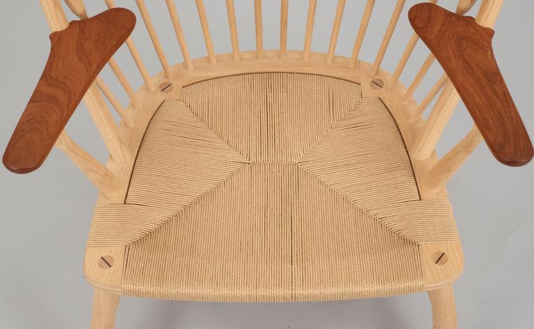A Hans J Wegner ash and teak 'Peacock chair', by PP Møbler, Denmark.