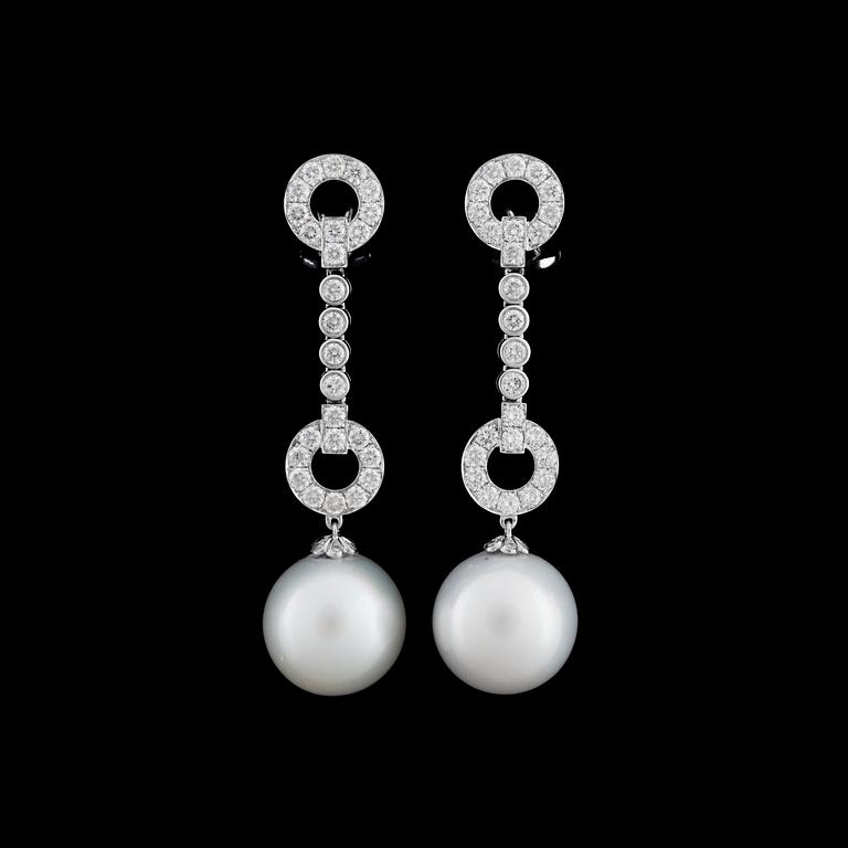 A pair of cultured South sea pearl and brilliant cut diamond earrings, tot 2.24 ct.