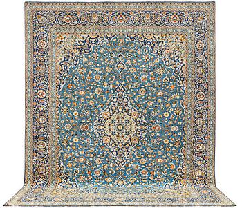 A Kashan carpet, signed Isfahanian, a. 407 x 310 cm.